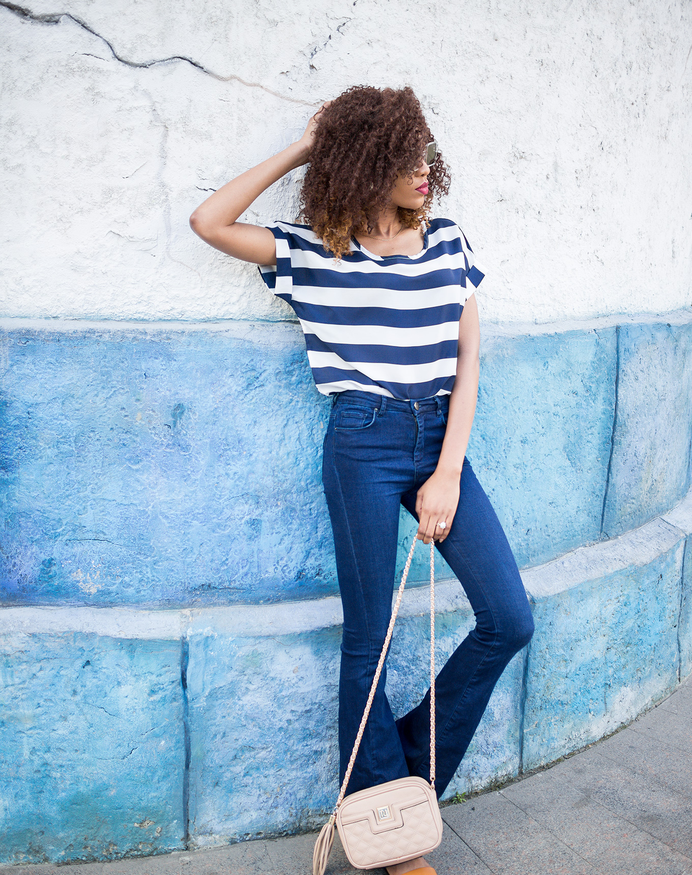 Bold stripes outfit on flare jeans