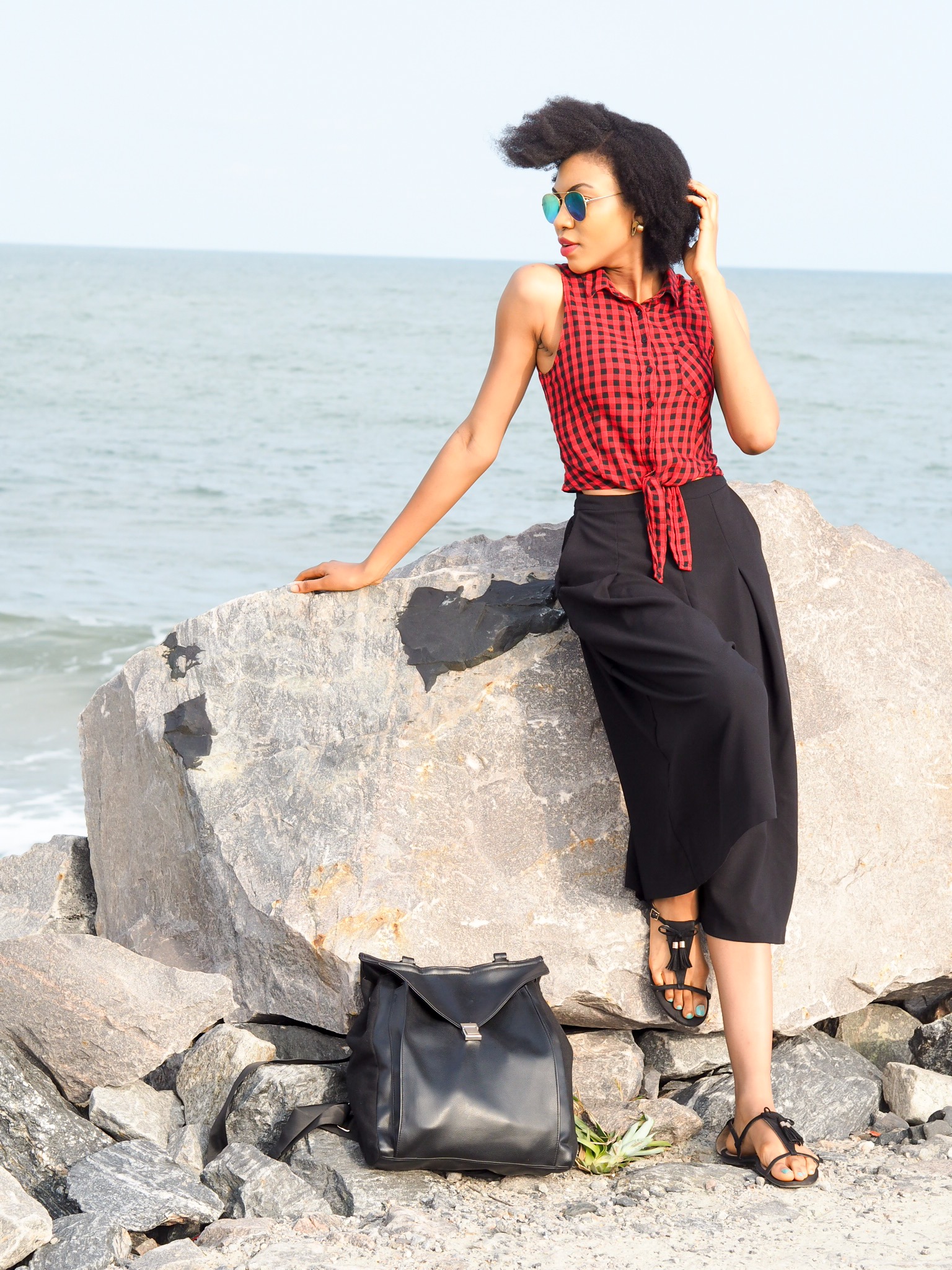 Nigerian blogger Modavracha in red check shirt beach outfit 