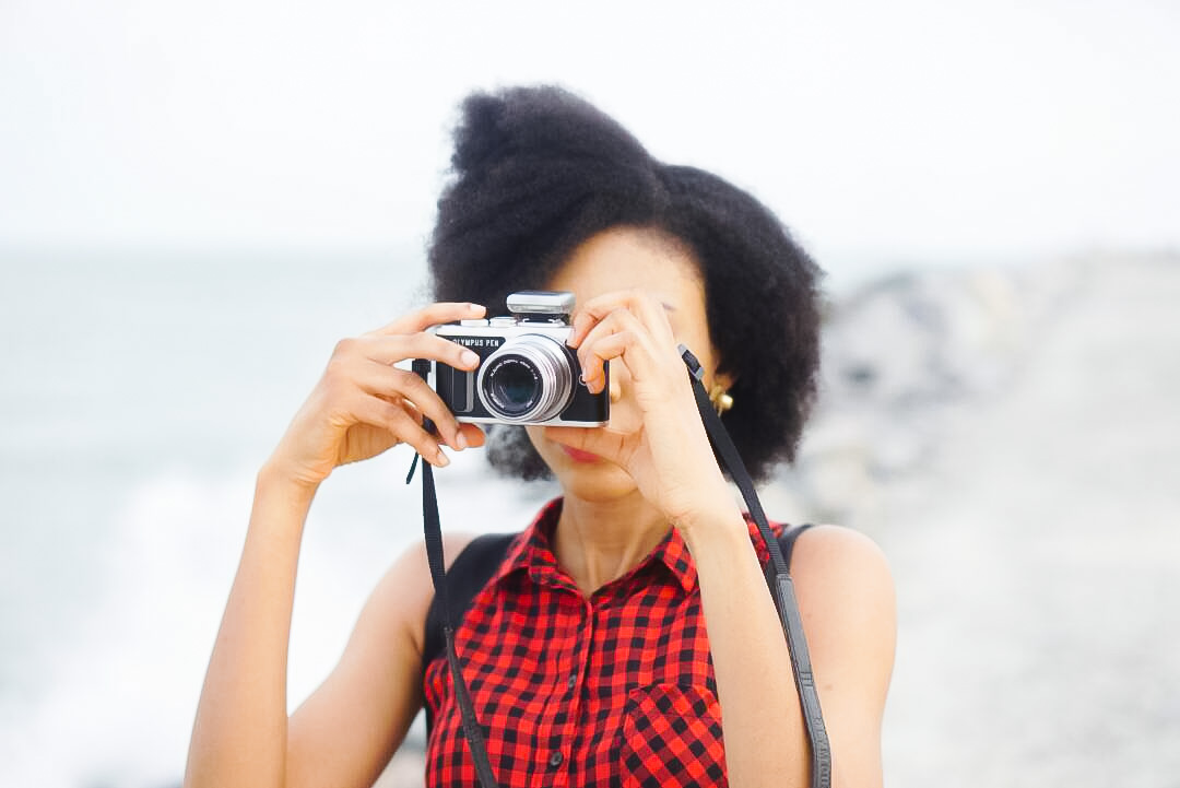 Abuja based Nigerian blogger using Olympus pen camera