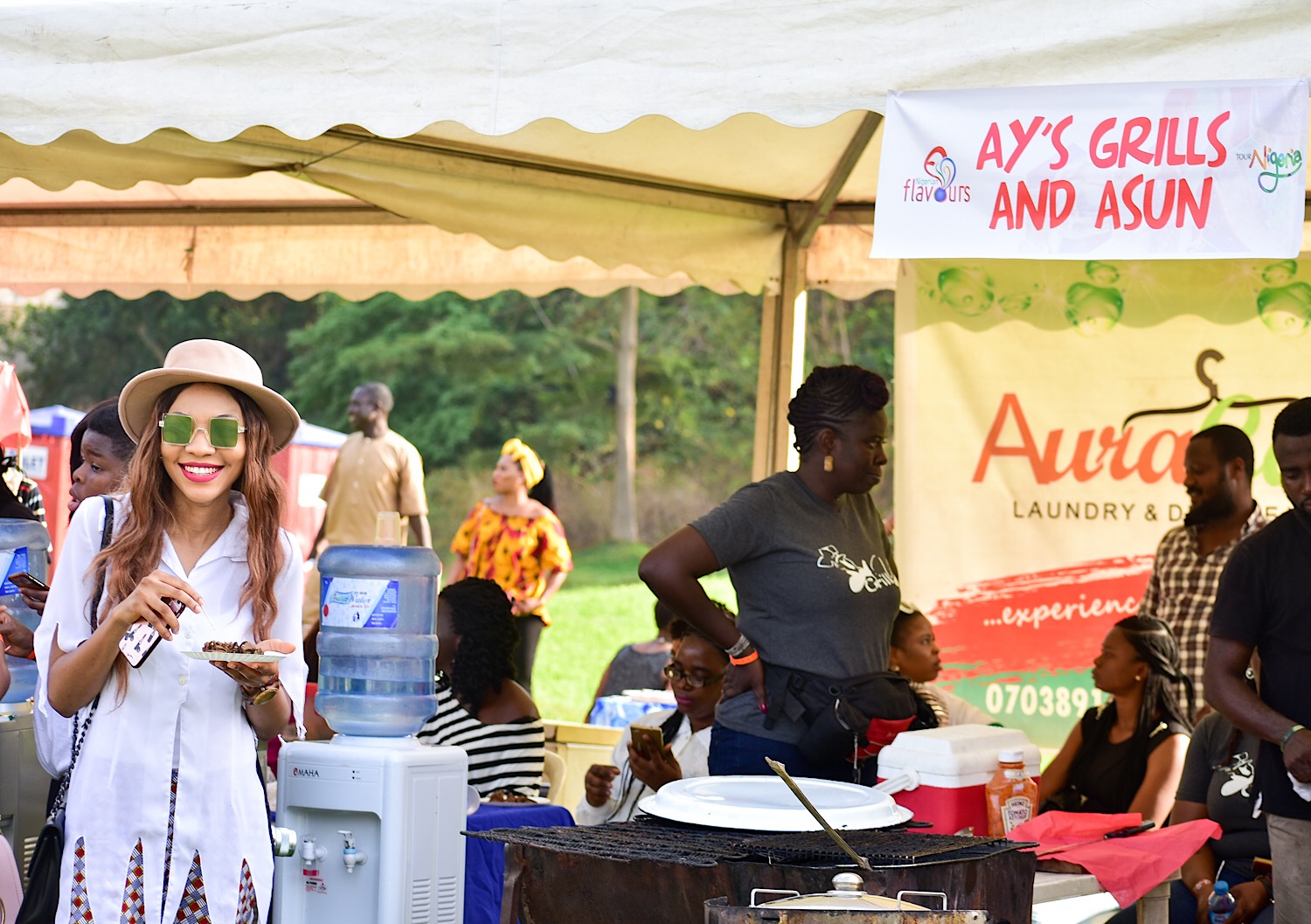 Blogger Modavracha trying out Asun at Nigerian flavours 2018 in Abuja