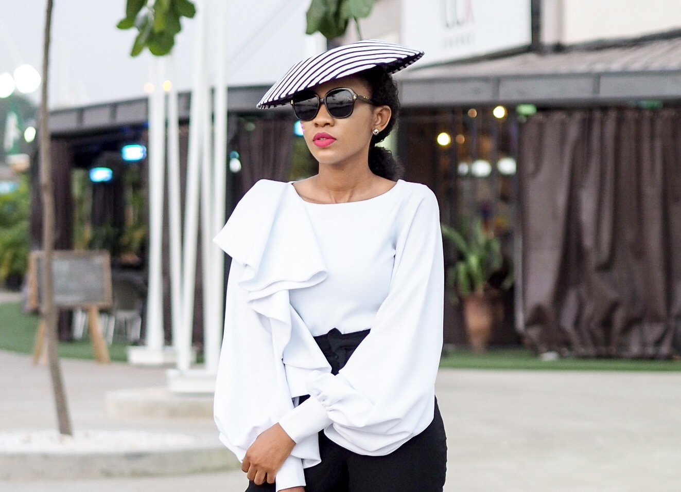 black and white monochrome outfit with saucer hat