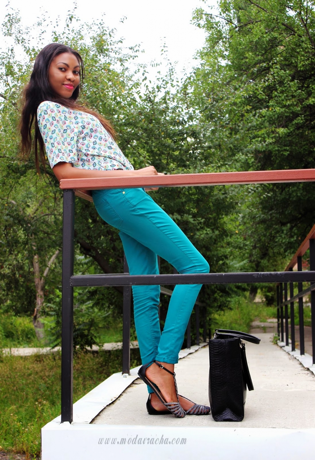 floral blouse and green trousers